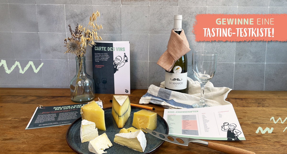 KI generiert: Ein Wein- und Käse-Set auf einem Tisch. Text: "GEWINNE eine TASTING-TESTKISTE!"