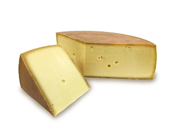 KI generiert: Zwei Stücke halbfester Käse, einer davon ist angeschnitten, um die Textur zu zeigen.