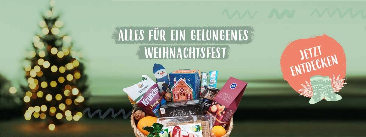 KI generiert: Ein Geschenkkorb mit Weihnachtsartikeln. Text: "ALLES FÜR EIN GELUNGENES WEIHNACHTSFEST" und "JETZT ENTDECKEN".