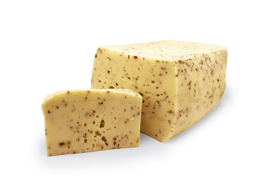 KI generiert: Ein Stück Käse mit Kräutern, teilweise angeschnitten.